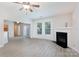 Bright living room features modern flooring, a cozy fireplace, and natural light at 1540 Coatsworth Ln, Rock Hill, SC 29732