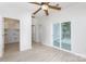 Bright living room with a ceiling fan, sliding glass doors, and wood-look flooring at 1540 Coatsworth Ln, Rock Hill, SC 29732