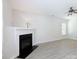 Spacious living room features a ceiling fan, neutral walls, and a fireplace at 1540 Coatsworth Ln, Rock Hill, SC 29732