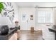 Inviting entryway features wood floors, a decorative clock, and ample natural light at 1624 Savory Ln, Charlotte, NC 28216