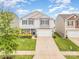 Charming two-story home featuring a well-maintained lawn and inviting curb appeal with blue shutters at 1624 Savory Ln, Charlotte, NC 28216