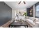 Open-concept living room featuring a spacious sofa, modern decor, and seamless kitchen access at 1624 Savory Ln, Charlotte, NC 28216