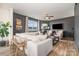 Modern living room with a large, comfortable white sectional sofa and a cozy fireplace at 1624 Savory Ln, Charlotte, NC 28216