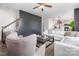 Cozy living room with neutral tones, modern decor, and a ceiling fan provides comfortable relaxation and style at 1624 Savory Ln, Charlotte, NC 28216