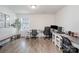 Spacious home office with multiple desks, natural light, and ample workspace at 1624 Savory Ln, Charlotte, NC 28216