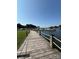Scenic dock with rope railing, offering a walkway to boating facilities and stunning waterfront views at 18511 Harborside Dr, Cornelius, NC 28031