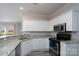 Well-appointed kitchen with granite countertops, stainless steel appliances, and ample cabinet space at 18511 Harborside Dr, Cornelius, NC 28031