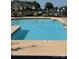 Community swimming pool featuring clear blue water, shallow end marking, and lounge chairs, ideal for summer enjoyment at 18511 Harborside Dr, Cornelius, NC 28031
