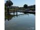Tranquil water view showcasing boat docks, waterfront condos, and serene natural surroundings at 18511 Harborside Dr, Cornelius, NC 28031
