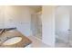 Bright bathroom featuring a double vanity with granite countertops and glass-enclosed shower at 2143 Barrowcliffe Nw Dr, Concord, NC 28027