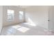Spacious bedroom with neutral carpet and two framed windows at 2143 Barrowcliffe Nw Dr, Concord, NC 28027