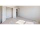 Spacious bedroom with neutral carpet, closet with shelving, and bright natural light at 2143 Barrowcliffe Nw Dr, Concord, NC 28027