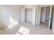Bedroom with an open closet and bright natural light at 2143 Barrowcliffe Nw Dr, Concord, NC 28027