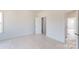 Bright bedroom features neutral walls, carpet flooring and is spacious with doorways to other rooms at 2143 Barrowcliffe Nw Dr, Concord, NC 28027