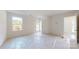 Bright bedroom with carpet flooring, a large window and a glass door to the outside patio at 2143 Barrowcliffe Nw Dr, Concord, NC 28027