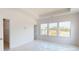 Bedroom with large windows offering natural light and a closet at 2143 Barrowcliffe Nw Dr, Concord, NC 28027