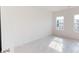 Bedroom filled with natural light, highlighting the hardwood floors and white walls at 2143 Barrowcliffe Nw Dr, Concord, NC 28027