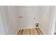 Walk-in closet with wooden floors and a wire shelving unit for storage at 2143 Barrowcliffe Nw Dr, Concord, NC 28027
