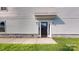 Charming front entrance with black door, stone accents, and manicured lawn at 2143 Barrowcliffe Nw Dr, Concord, NC 28027