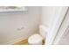 A minimalist powder room with a toilet and wood-look flooring at 2143 Barrowcliffe Nw Dr, Concord, NC 28027