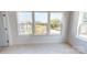 Bedroom with three windows offering natural light and neighborhood views at 2143 Barrowcliffe Nw Dr, Concord, NC 28027