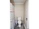 A full bathroom features a toilet, shower with curtain, and neutral colored walls at 218 Blacksnake Rd, Stanley, NC 28164
