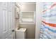 Bathroom featuring a vanity, mirror, and shower with a striped curtain at 218 Blacksnake Rd, Stanley, NC 28164