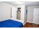 Bedroom with wood-look floors, white trim and a closet for storage at 218 Blacksnake Rd, Stanley, NC 28164