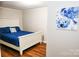 Bright bedroom with stylish decor and wood-look floors offers a cozy retreat at 218 Blacksnake Rd, Stanley, NC 28164