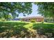 Spacious backyard with mature trees, offering a private and serene outdoor space at 2526 Ashford Dr, Newton, NC 28658