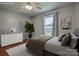 Bedroom featuring a ceiling fan, a window view to the outside, and minimalist decor at 2526 Ashford Dr, Newton, NC 28658