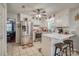 Bright kitchen with stainless steel appliances, tile floors, breakfast bar, and adjacent to an open living area at 2526 Ashford Dr, Newton, NC 28658