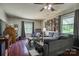 Comfortable living room showcasing neutral tones, wood floors, abundant natural light, and a decorative ceiling fan at 2526 Ashford Dr, Newton, NC 28658