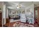 Comfortable living room with hardwood floors, ceiling fan, and ample natural light at 2526 Ashford Dr, Newton, NC 28658