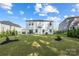 Expansive backyard with green grass, black mulch and views of neighboring houses at 4046 Armstrong Farm Dr, Belmont, NC 28012