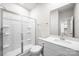 Bright bathroom showcasing a walk-in shower, white vanity, and mirrored wall at 4046 Armstrong Farm Dr, Belmont, NC 28012