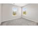 Well-lit bedroom with two windows offering neighborhood views at 4046 Armstrong Farm Dr, Belmont, NC 28012