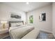 Bright bedroom featuring a comfortable queen bed, soft carpet, and natural light from a window at 4046 Armstrong Farm Dr, Belmont, NC 28012