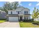 Charming two-story home with stone accents, well-manicured lawn, and a two-car garage at 4046 Armstrong Farm Dr, Belmont, NC 28012
