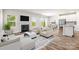 Open-concept living room with fireplace, hardwood floors, and seamless flow to dining area at 4046 Armstrong Farm Dr, Belmont, NC 28012