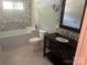 Stylish bathroom with modern vanity, tile floor and tub at 4050 Rollingwood Cir, Rock Hill, SC 29732