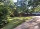 Single-story home with a garage in a large grassy yard with mature trees at 4050 Rollingwood Cir, Rock Hill, SC 29732
