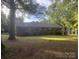 Charming single-story home with brick facade nestled among mature trees and a spacious front yard at 4050 Rollingwood Cir, Rock Hill, SC 29732