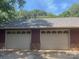 Spacious two-car garage with brick detail and mature trees overhead at 4050 Rollingwood Cir, Rock Hill, SC 29732