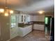 Well-lit kitchen featuring tile floors, granite counters, and sleek white cabinets at 4050 Rollingwood Cir, Rock Hill, SC 29732