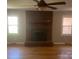 Large Living room showcasing fireplace, hardwood floors, and natural light at 4050 Rollingwood Cir, Rock Hill, SC 29732