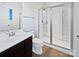 This full bathroom features a glass shower door, sink, and commode at 5013 Crandon Rd, Fort Mill, SC 29707