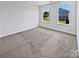 Bright bedroom with large windows, neutral paint, plush carpet and natural light at 5013 Crandon Rd, Fort Mill, SC 29707