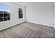 A carpeted bedroom offers two large windows for lots of natural light at 5013 Crandon Rd, Fort Mill, SC 29707