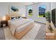 Bright bedroom with a cozy rug, large windows, stylish decor and hardwood furniture at 5013 Crandon Rd, Fort Mill, SC 29707